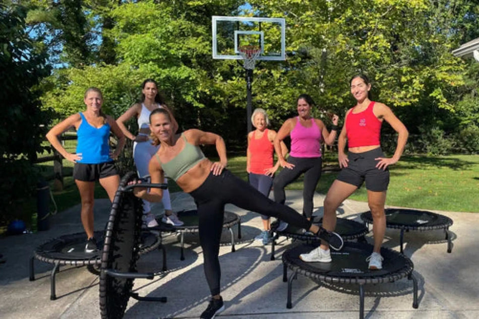 Group of women getting read to do a JumpSport Trampoline Cardio Workout.