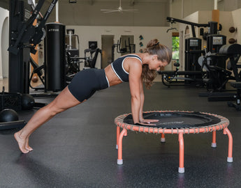 Girl doing a plank on the edge of JumpSport