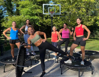 Group of women getting read to do a JumpSport Trampoline Cardio Workout. 