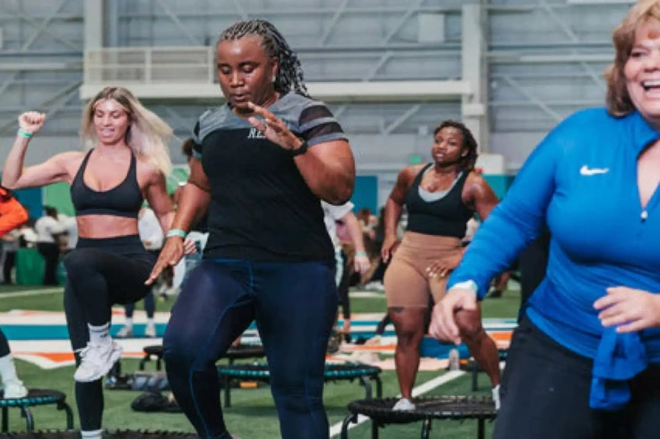 Group of bouncers doing cardio workouts on JumpSport Fitness trampolines.
