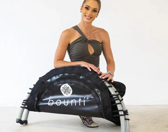 Lisa Raleigh with a folding JumpSport Fitness trampoline, announcing a strategic partnership.