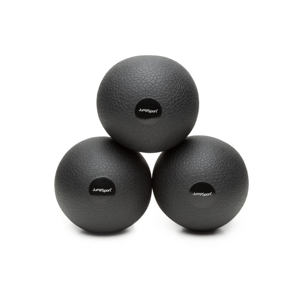 Three JumpSport toning balls stacked